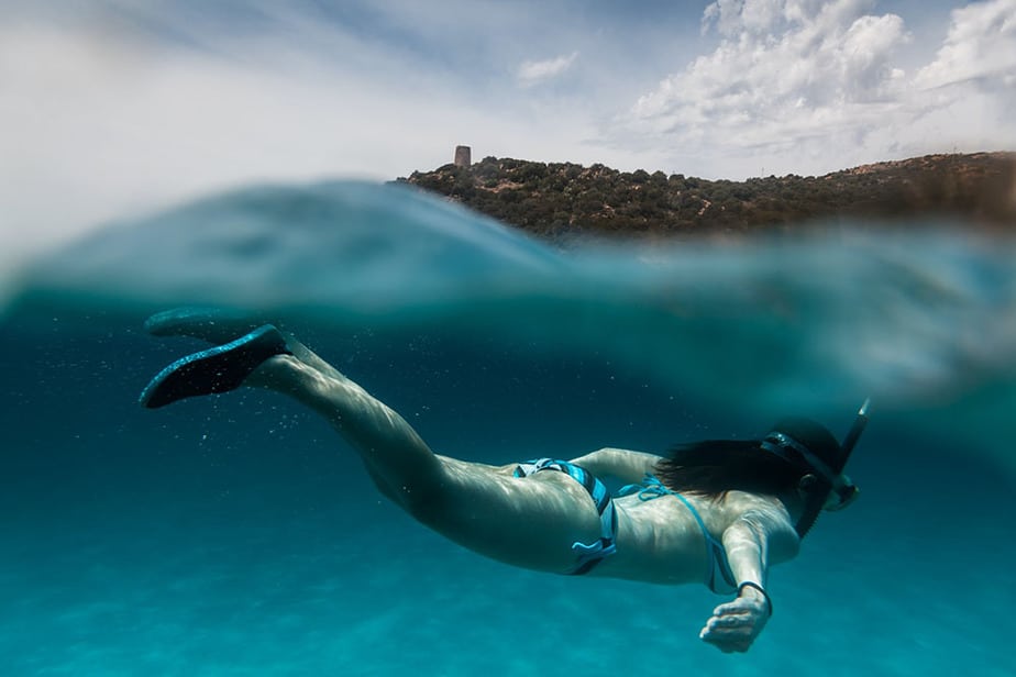 girl snorkeling with water shoes