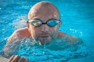 do bald professional racers need to wear swim caps?