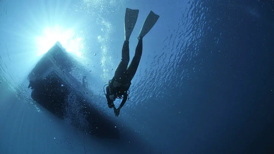 freediving by a boat
