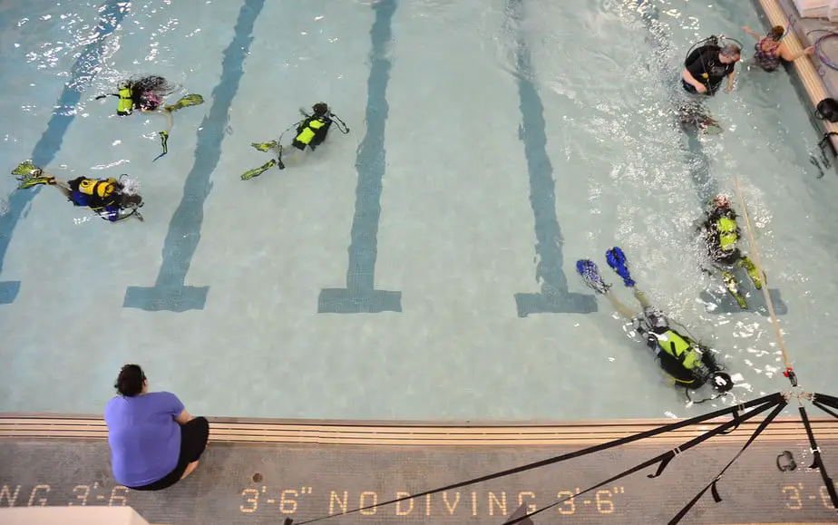 kids diving in a pool