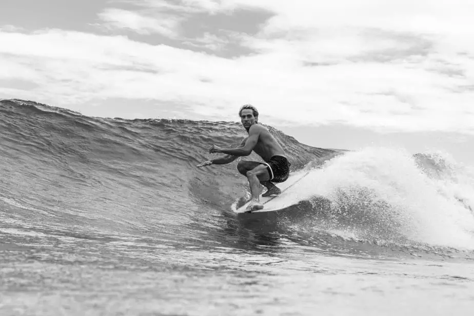 surfing shirtless black and white