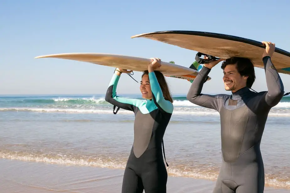 why do surfers wear wetsuits
