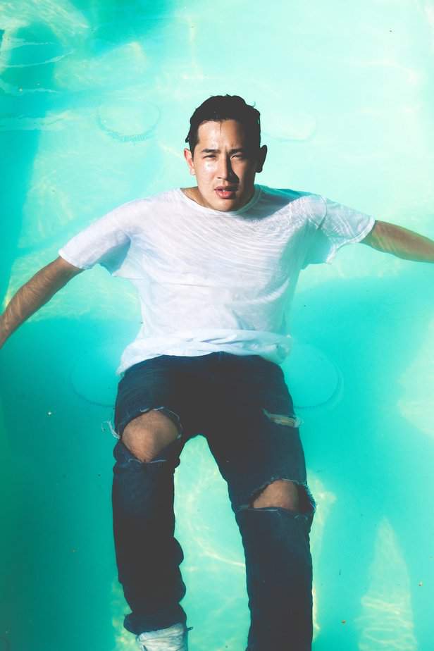 Fully clothed man in the pool