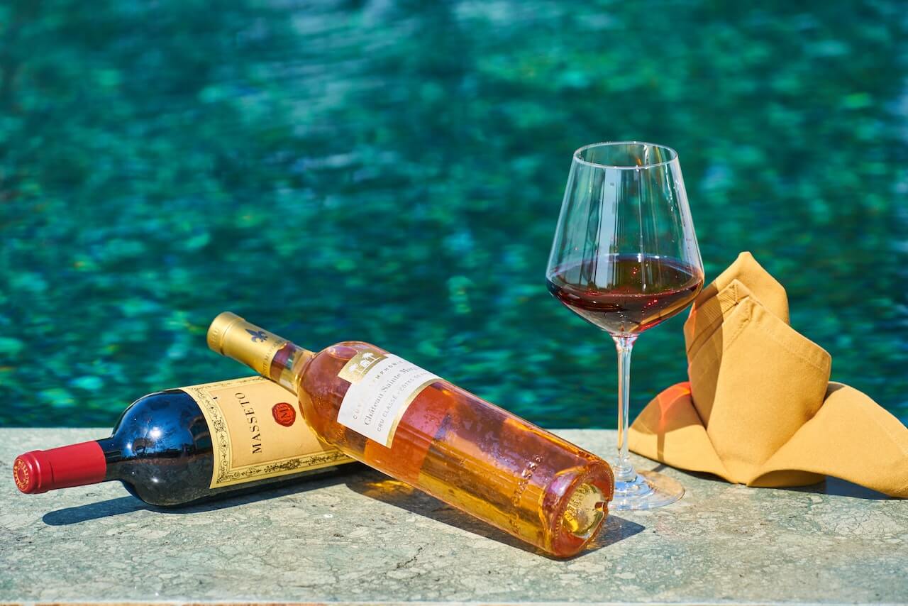 wine bottles by the pool